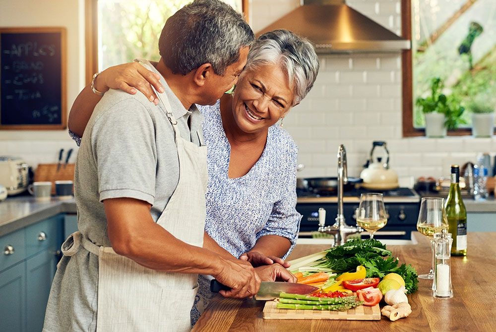 older couple preparing dinner