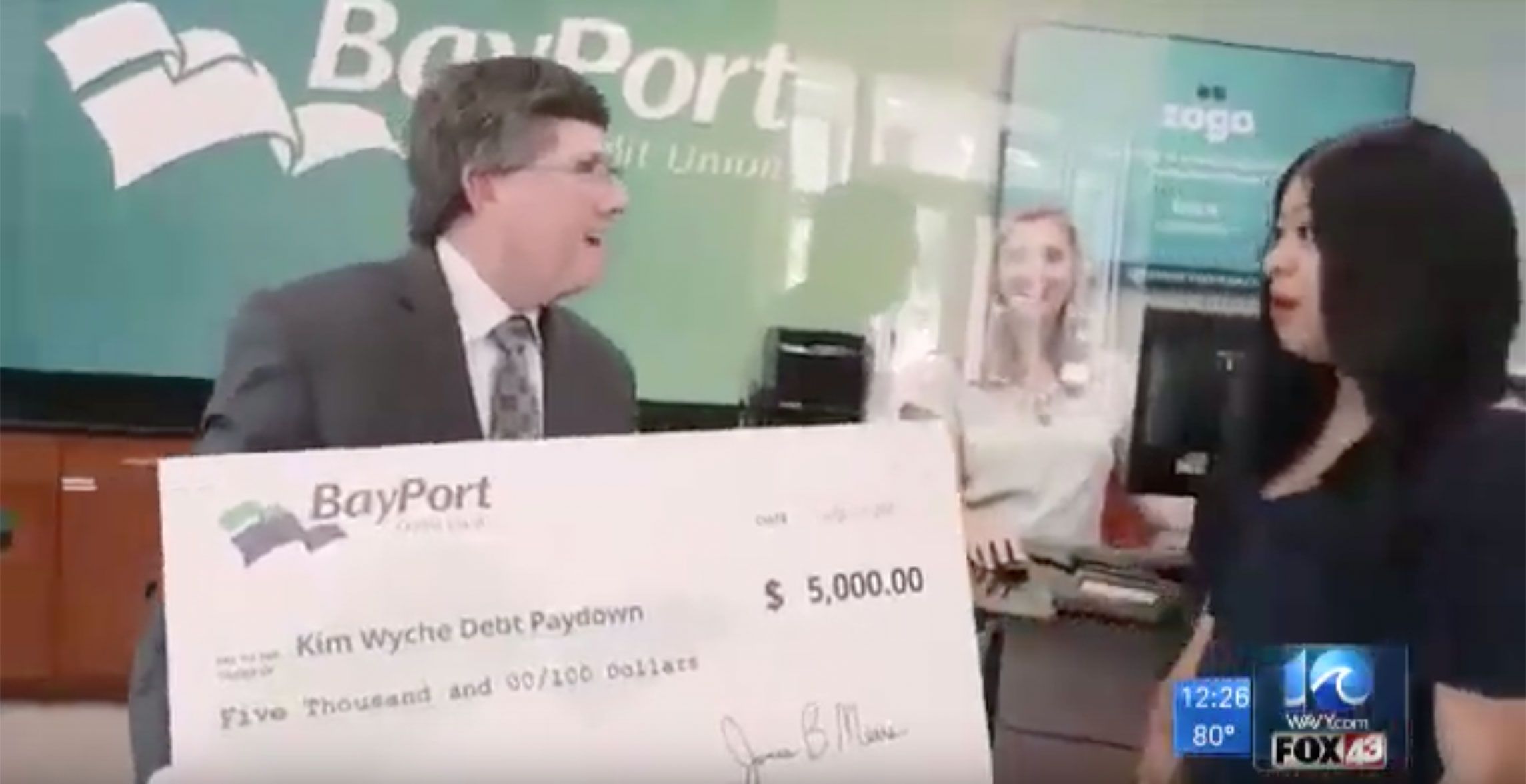 BayPort CEO Jim Mears presents check to Debt Paydown winner